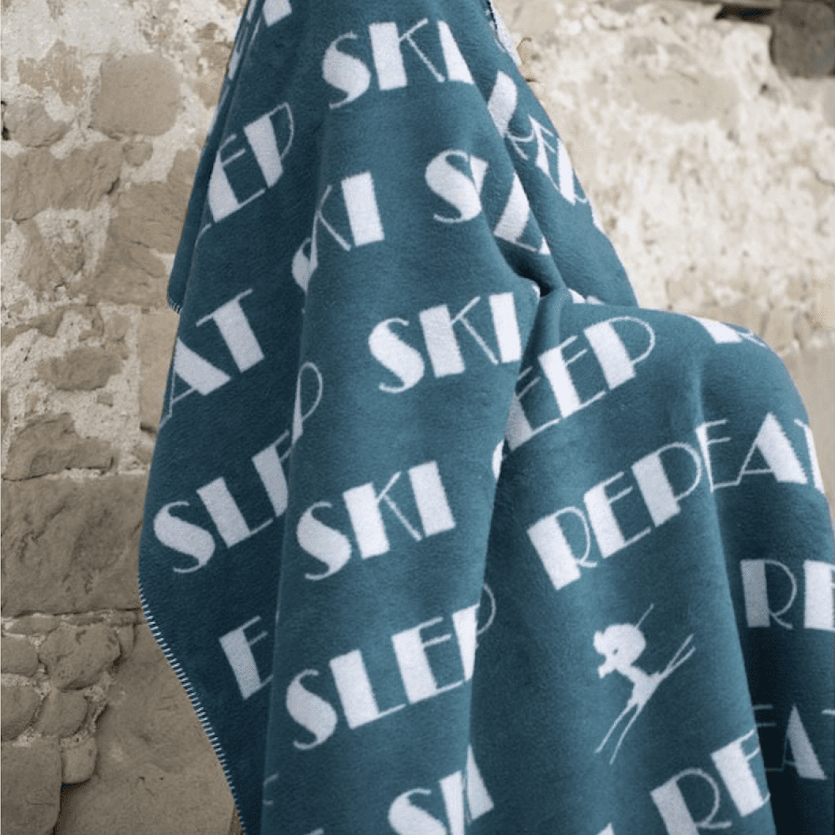 Immagine del prodotto Coperta Singola invernale in Cotone Eat Ski Sleep Repeat 150x200 cm (3 Colori) | David Fussenegger